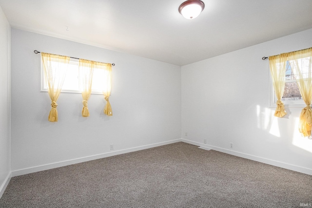 spare room featuring carpet floors