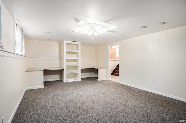 interior space with carpet and ceiling fan