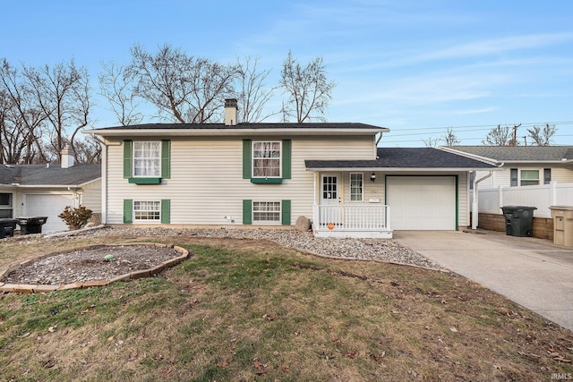 view of front of house with a front yard and a garage