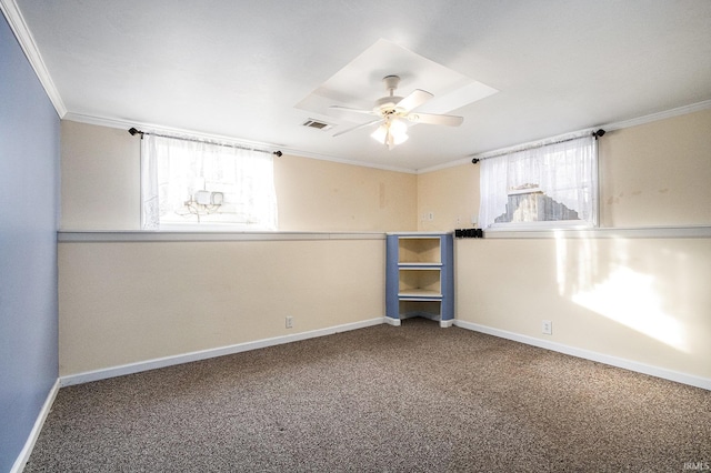 basement with carpet flooring, ceiling fan, and crown molding