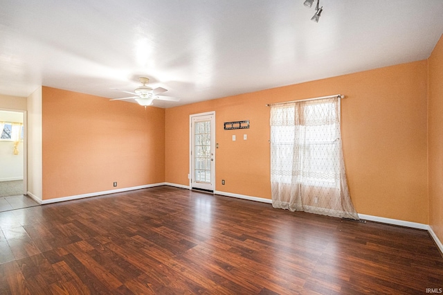 empty room featuring dark hardwood / wood-style floors and ceiling fan