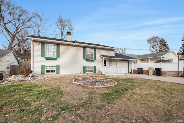 view of front facade with a front yard and a garage