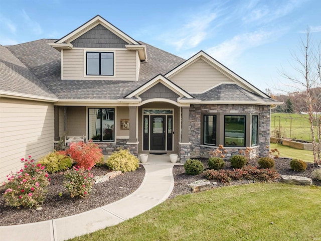 craftsman inspired home with a front yard