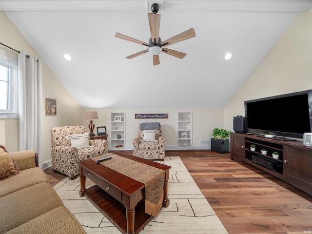 living room featuring ceiling fan, light hardwood / wood-style flooring, built in features, and lofted ceiling