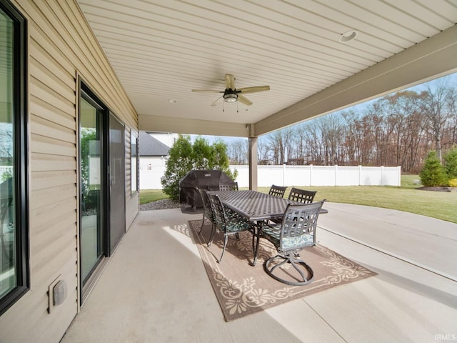 view of patio featuring area for grilling and ceiling fan