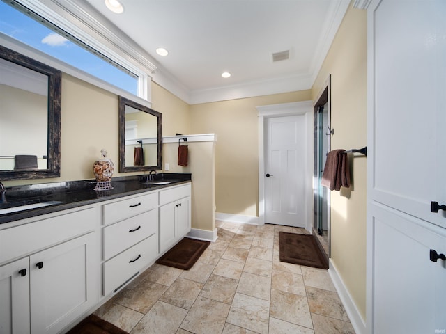 bathroom with vanity and ornamental molding