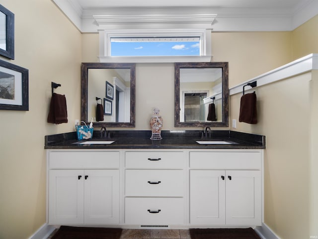 bathroom featuring vanity and ornamental molding