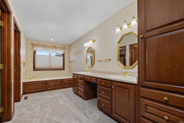 bathroom featuring vanity and a tub