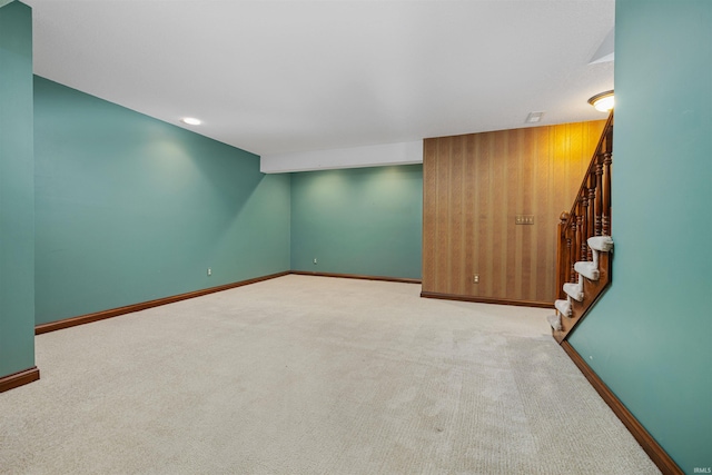 unfurnished room featuring light colored carpet