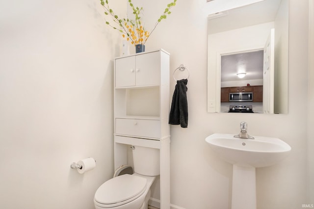 bathroom featuring toilet