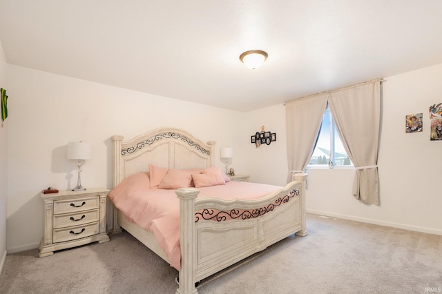 bedroom featuring light colored carpet