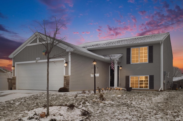 split level home featuring a garage