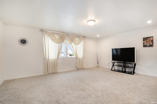 unfurnished living room with carpet flooring