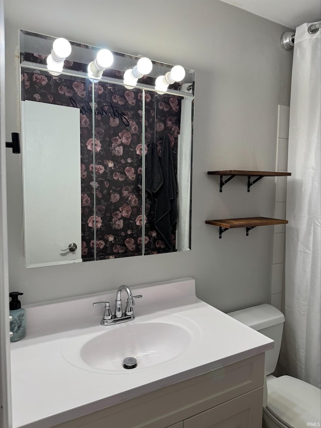 bathroom with vanity and toilet