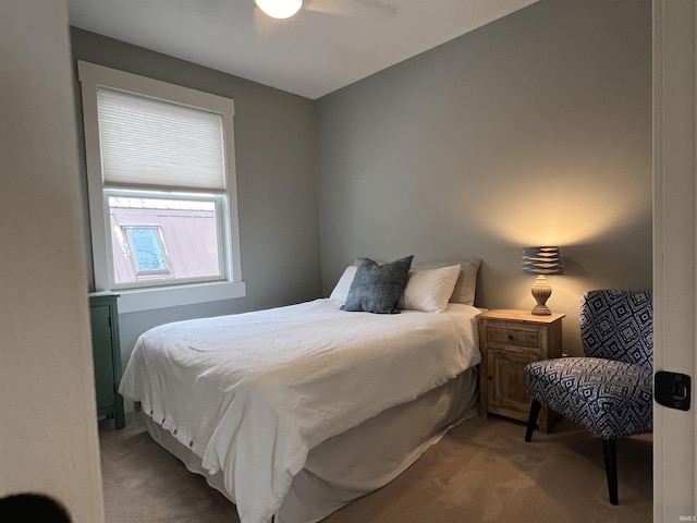 bedroom featuring ceiling fan and light colored carpet