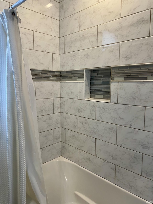 bathroom featuring shower / bathtub combination with curtain