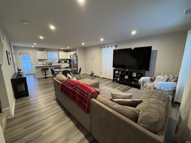 living room with light hardwood / wood-style floors