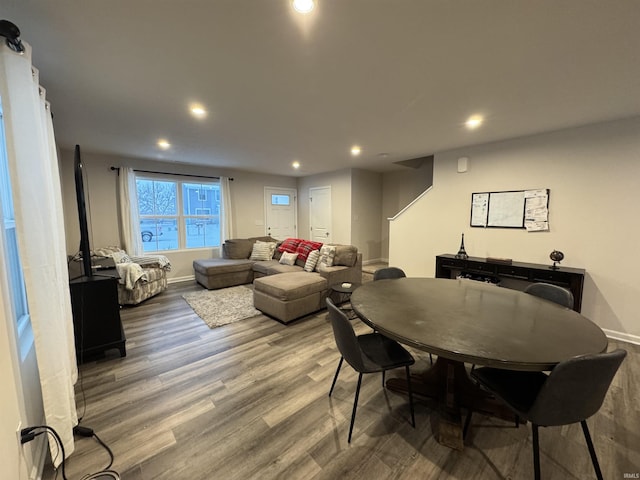 dining space with hardwood / wood-style floors