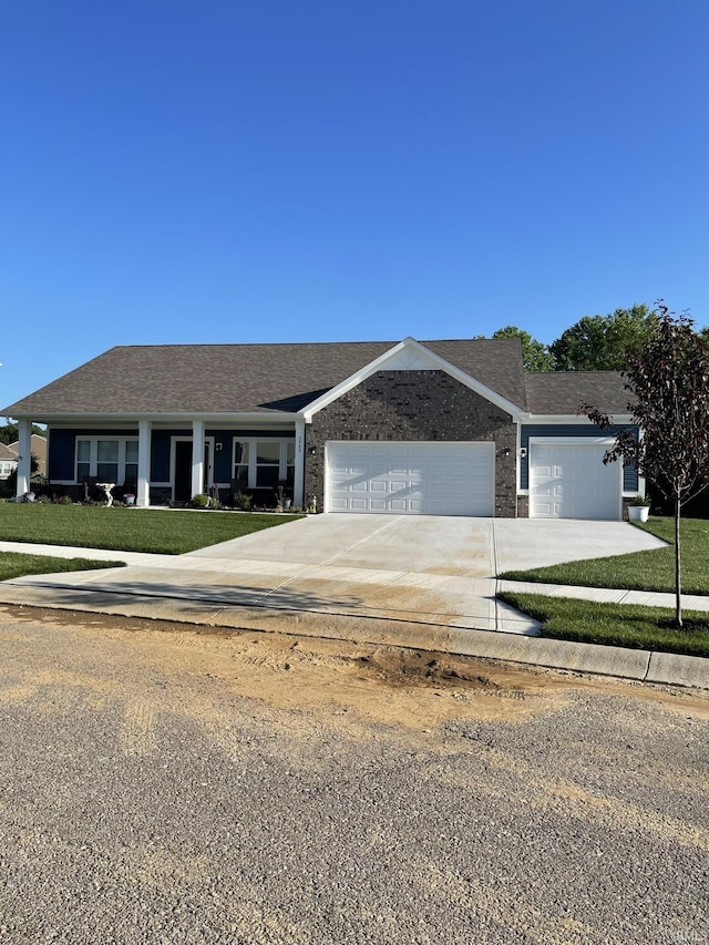 view of front of house with a front lawn and a garage