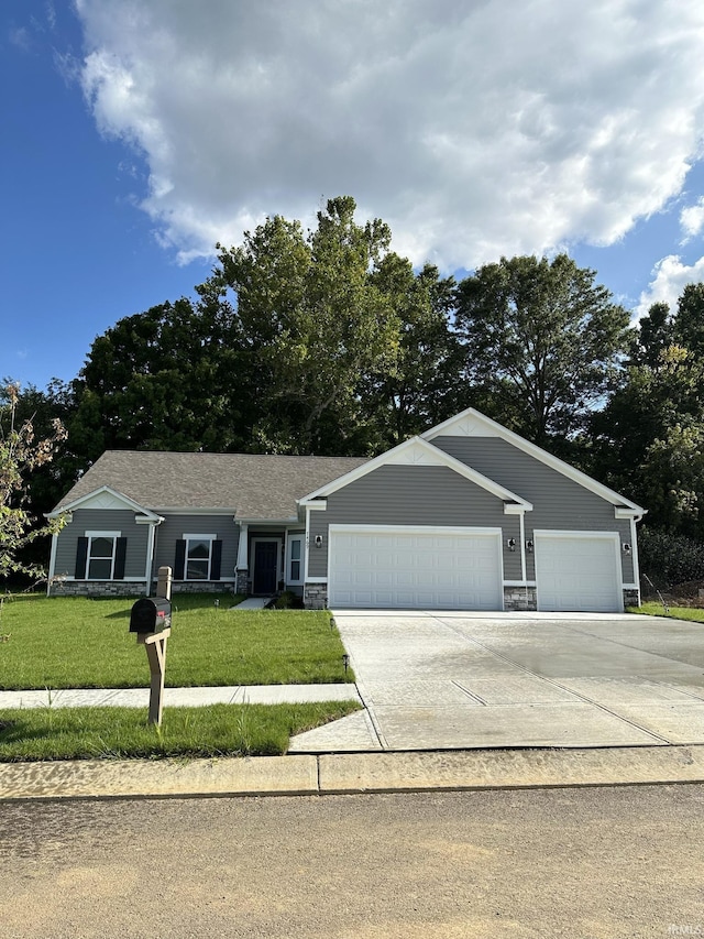 ranch-style home featuring a garage and a front lawn