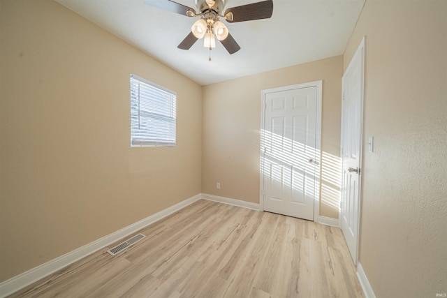 spare room featuring ceiling fan and light hardwood / wood-style flooring