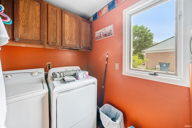 laundry area featuring cabinets and independent washer and dryer