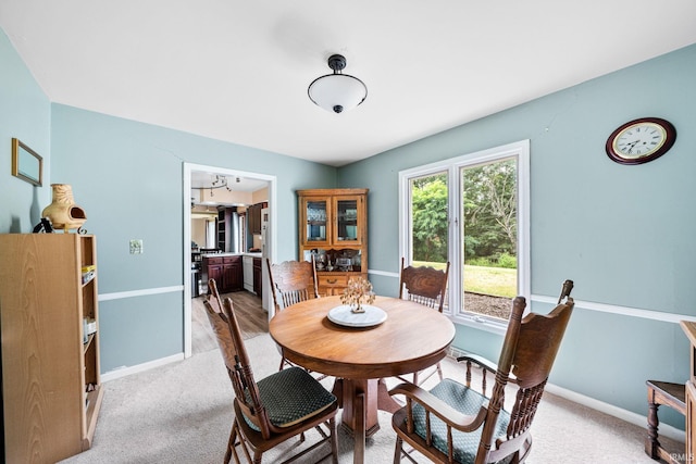 view of carpeted dining area