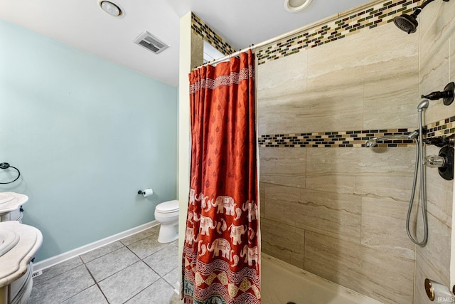 bathroom featuring toilet, vanity, tile patterned floors, and walk in shower