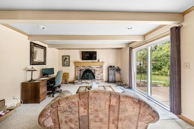 carpeted home office featuring beamed ceiling, ornamental molding, and a brick fireplace