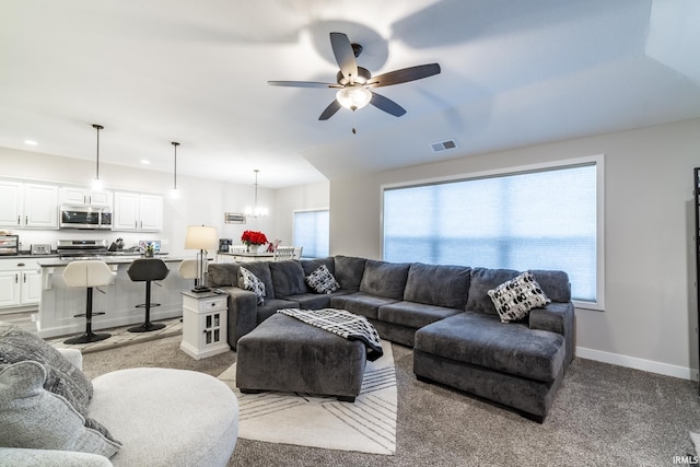 living room featuring ceiling fan and light carpet