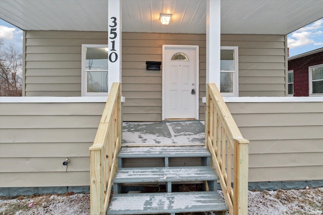 entrance to property with a porch