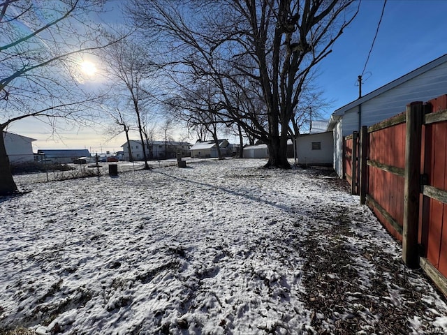 view of yard layered in snow