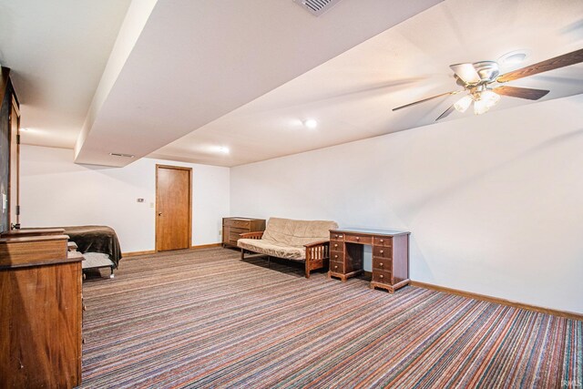 sitting room featuring ceiling fan and carpet