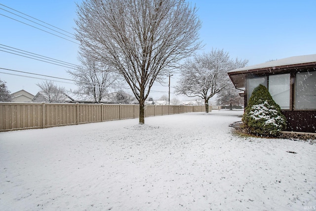 view of yard covered in snow