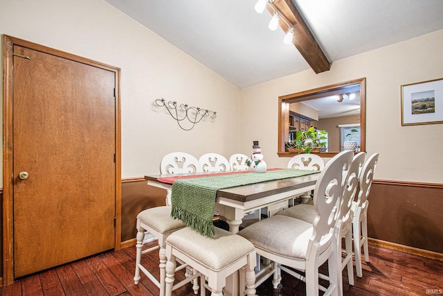 dining area featuring vaulted ceiling with beams and dark wood-type flooring