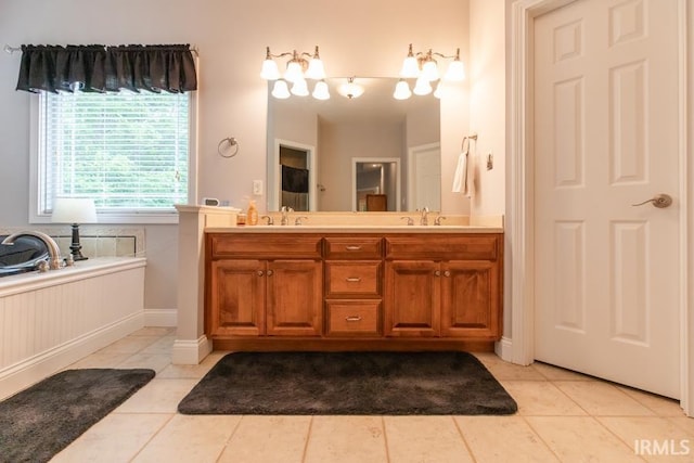 bathroom featuring a bathtub, tile patterned flooring, and vanity