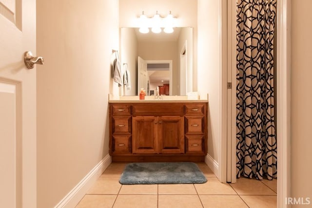 bathroom featuring tile patterned flooring and vanity