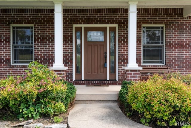 property entrance featuring a porch