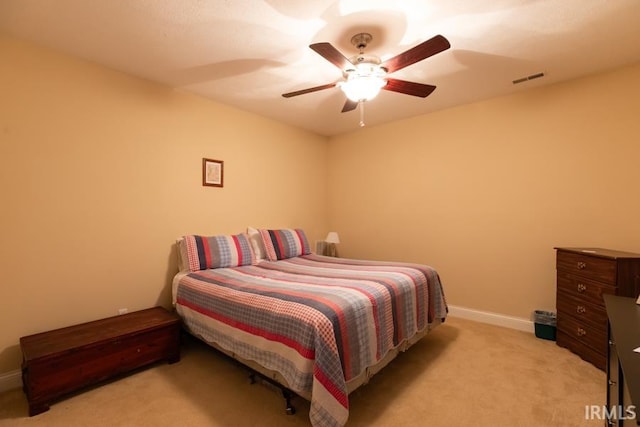 bedroom featuring ceiling fan and light carpet