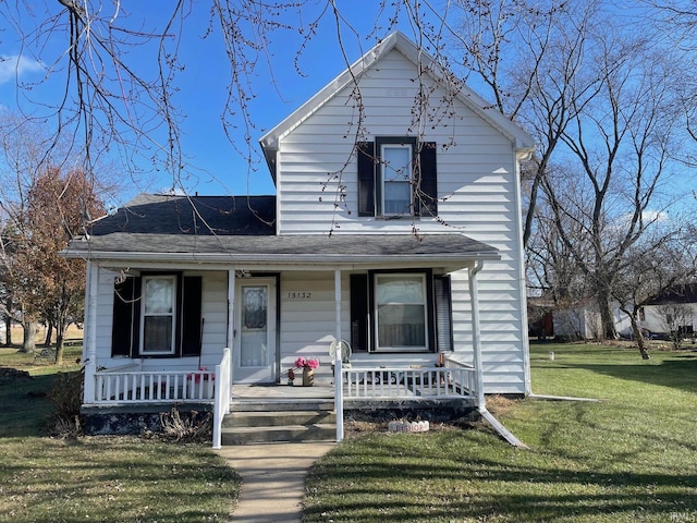 view of front facade featuring a porch and a front lawn