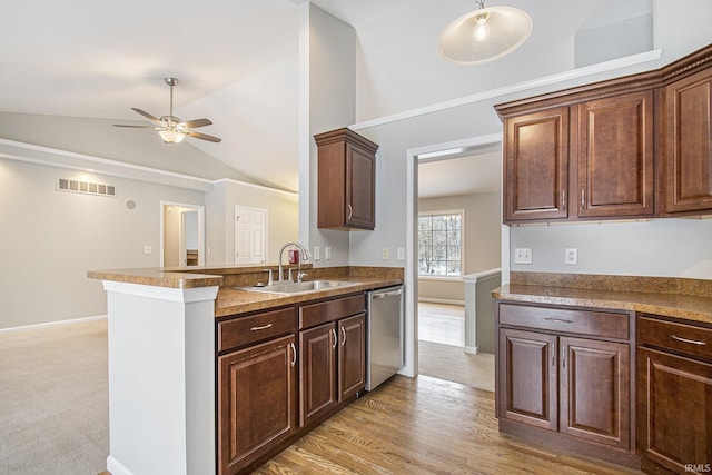 kitchen featuring dishwasher, lofted ceiling, sink, light hardwood / wood-style flooring, and ceiling fan