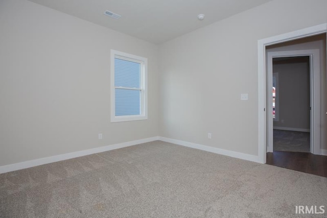 empty room featuring carpet flooring