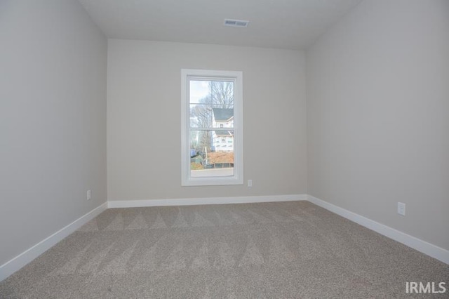 empty room with light colored carpet