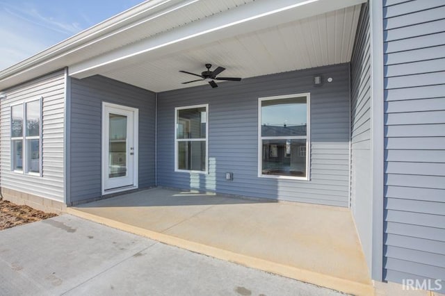 exterior space featuring ceiling fan