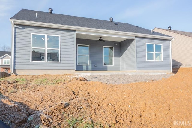 back of property with ceiling fan