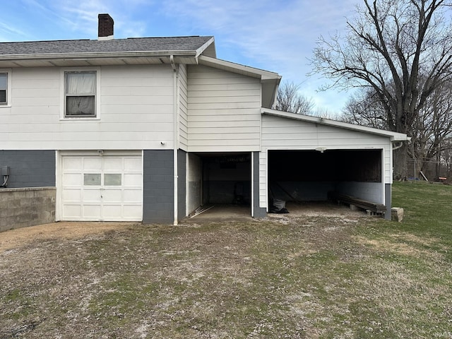 view of side of property with a garage