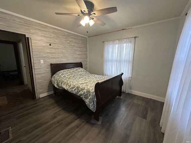 bedroom with ceiling fan, dark hardwood / wood-style flooring, and ornamental molding