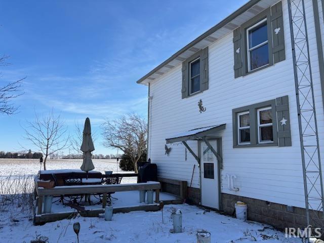 view of snow covered property