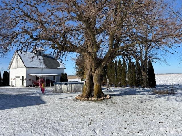 view of yard layered in snow