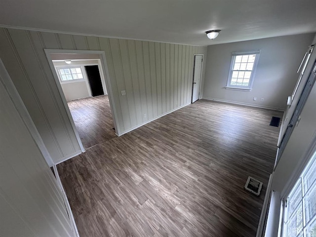 empty room featuring dark wood-type flooring